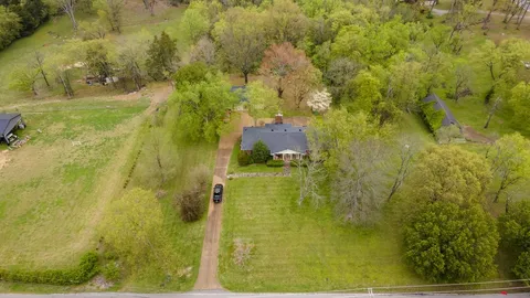 a bathroom with a blue painted wall