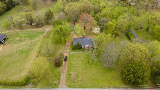 a bathroom with a blue painted wall