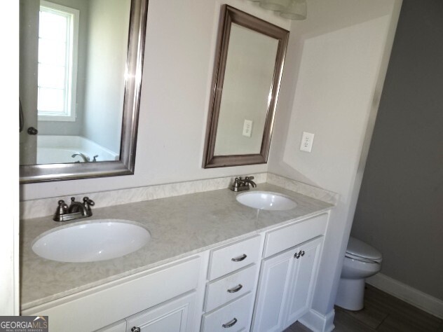 133 Worchester Circle Perry, GA 31069 - Photo 12 of 16 a bathroom with a sink and a mirror