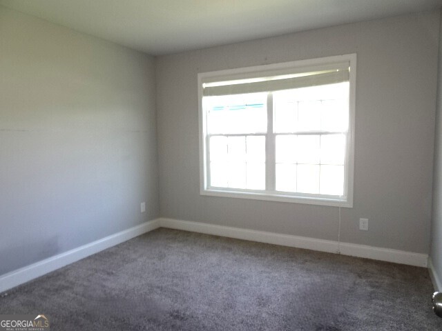 133 Worchester Circle Perry, GA 31069 - Photo 14 of 16 an empty room with a window