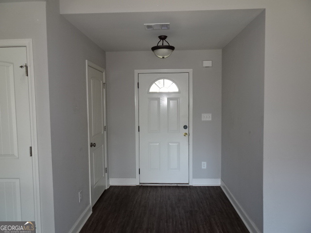 133 Worchester Circle Perry, GA 31069 - Photo 5 of 16 a view of empty room with wooden floor