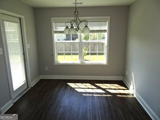 133 Worchester Circle Perry, GA 31069 - Photo 10 of 16 a view of empty room with wooden floor and fan