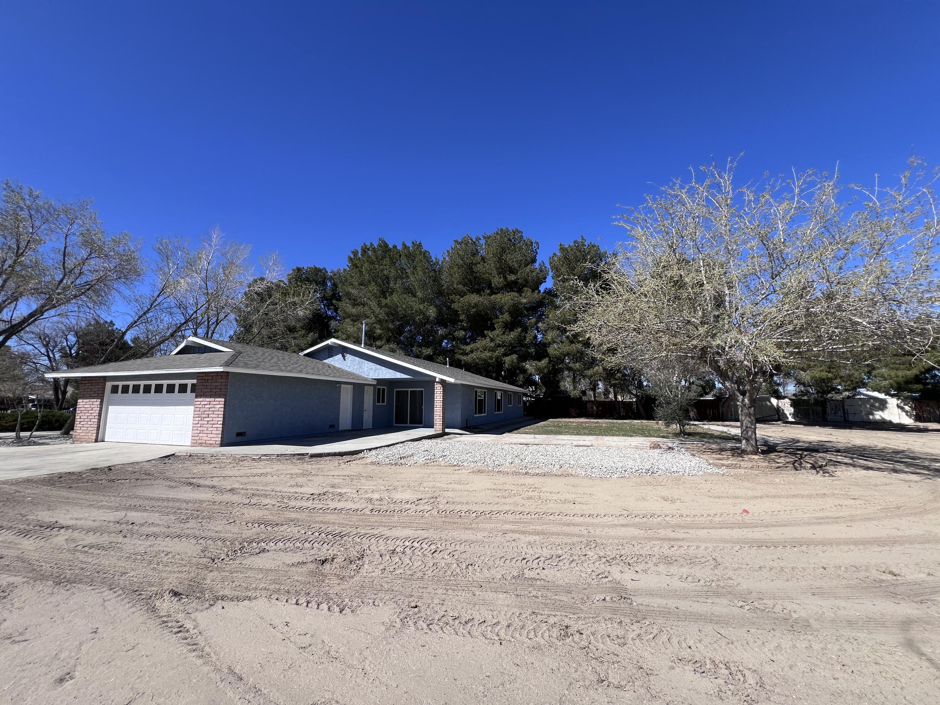 3255 East E Avenue Lancaster, CA 93535 - Photo 14 of 81 a view of house with a yard