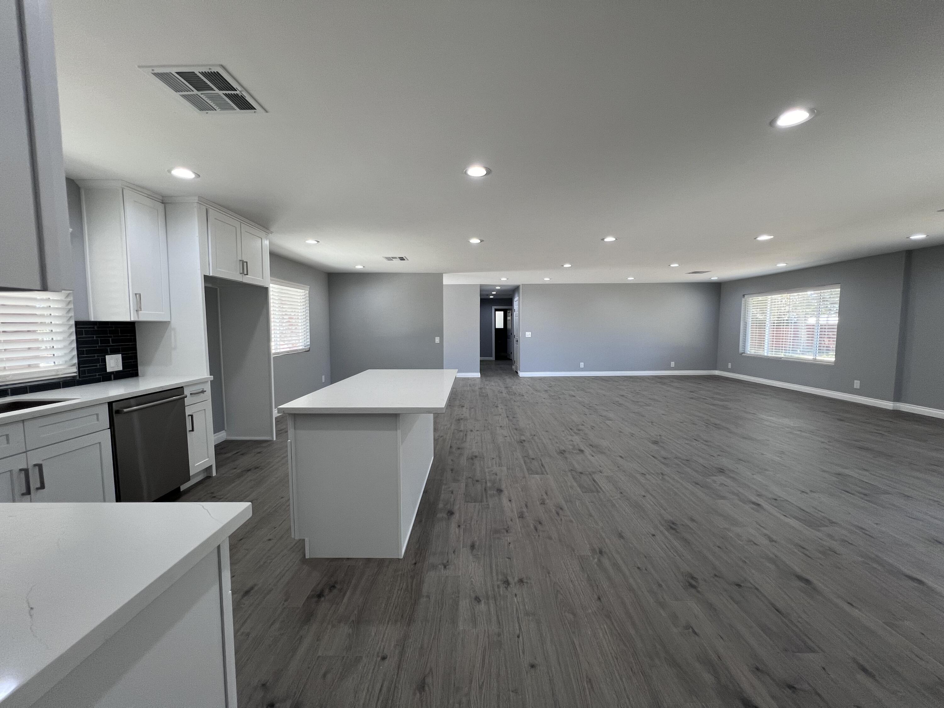 3255 East E Avenue Lancaster, CA 93535 - Photo 21 of 81 a view of a kitchen with a sink cabinets and wooden floor