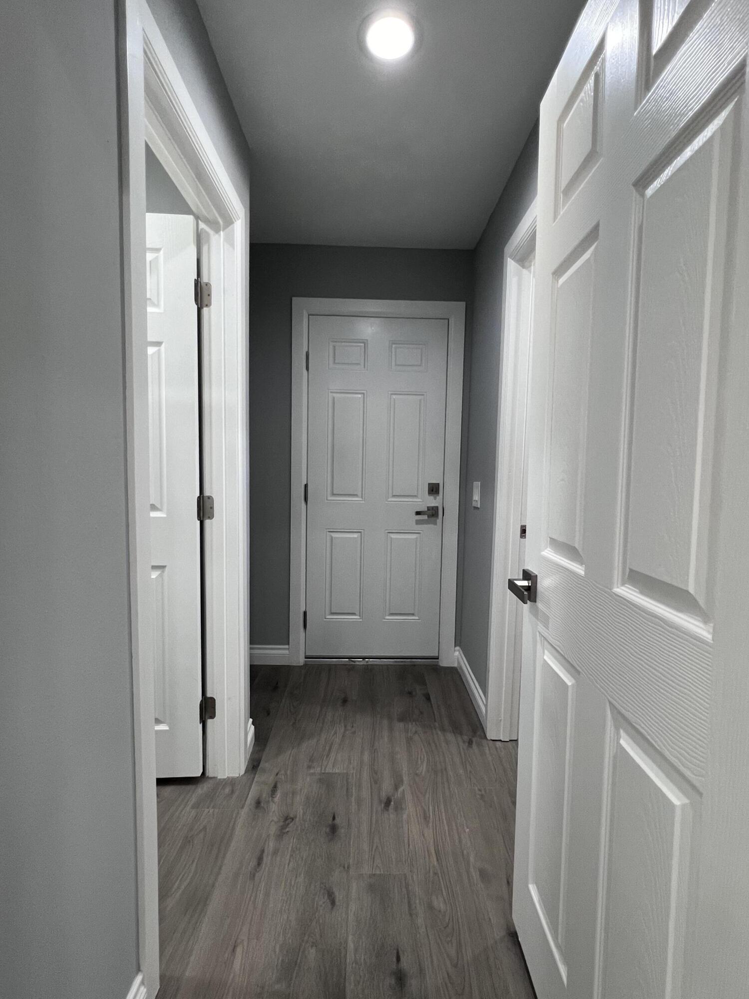 3255 East E Avenue Lancaster, CA 93535 - Photo 36 of 81 a view of a hallway with wooden floor