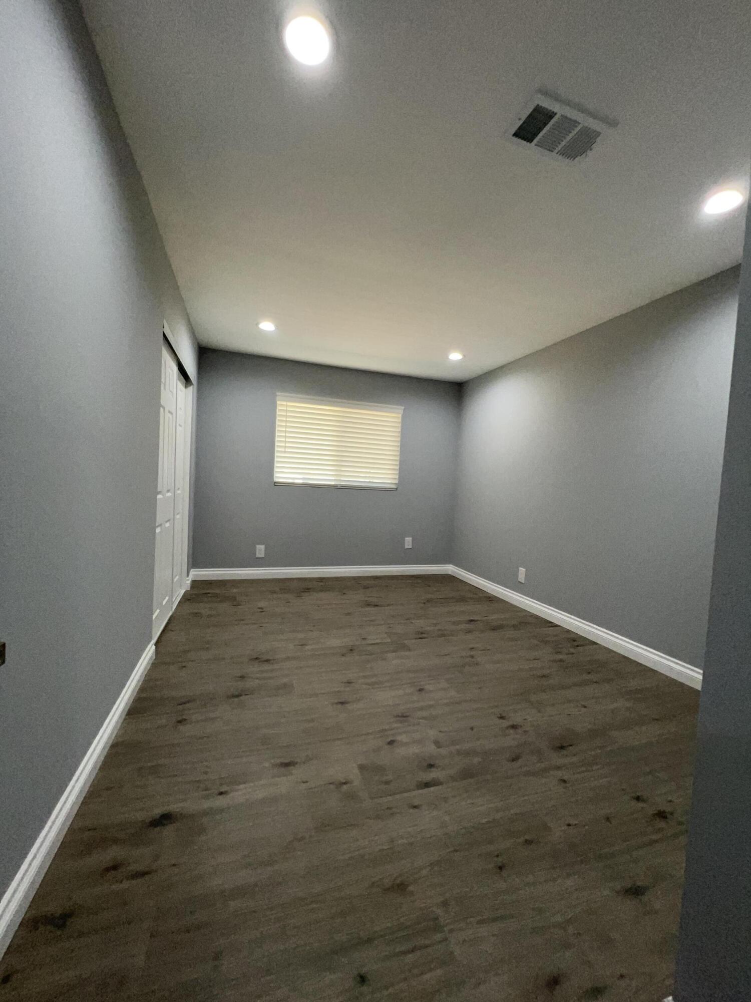 3255 East E Avenue Lancaster, CA 93535 - Photo 44 of 81 an empty room with a empty space and windows