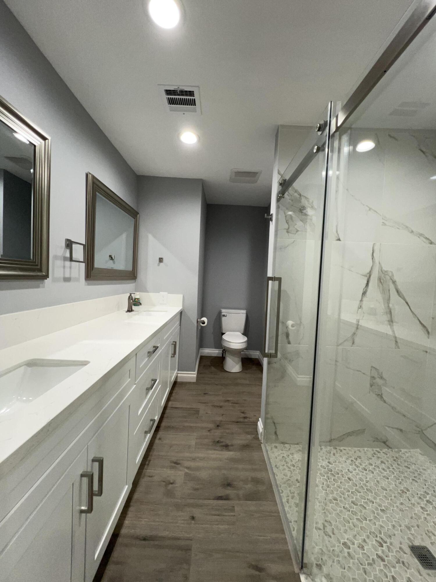3255 East E Avenue Lancaster, CA 93535 - Photo 64 of 81 a spacious bathroom with double vanity and a shower