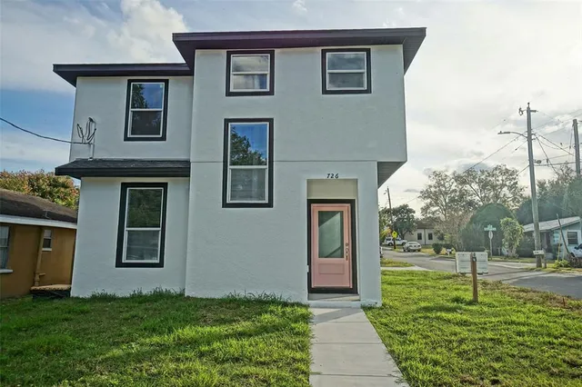 a house view with a garden space
