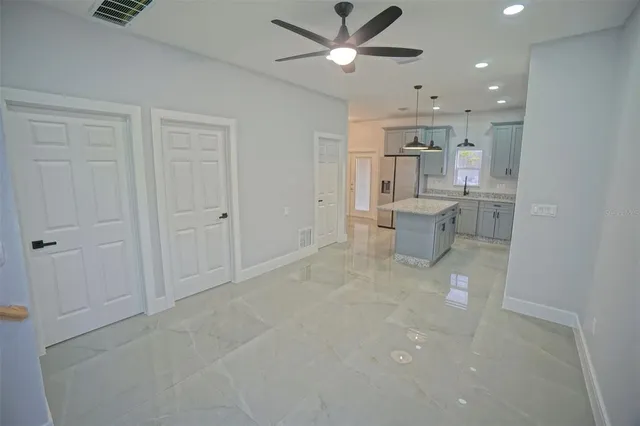 a view of a kitchen with a sink and microwave