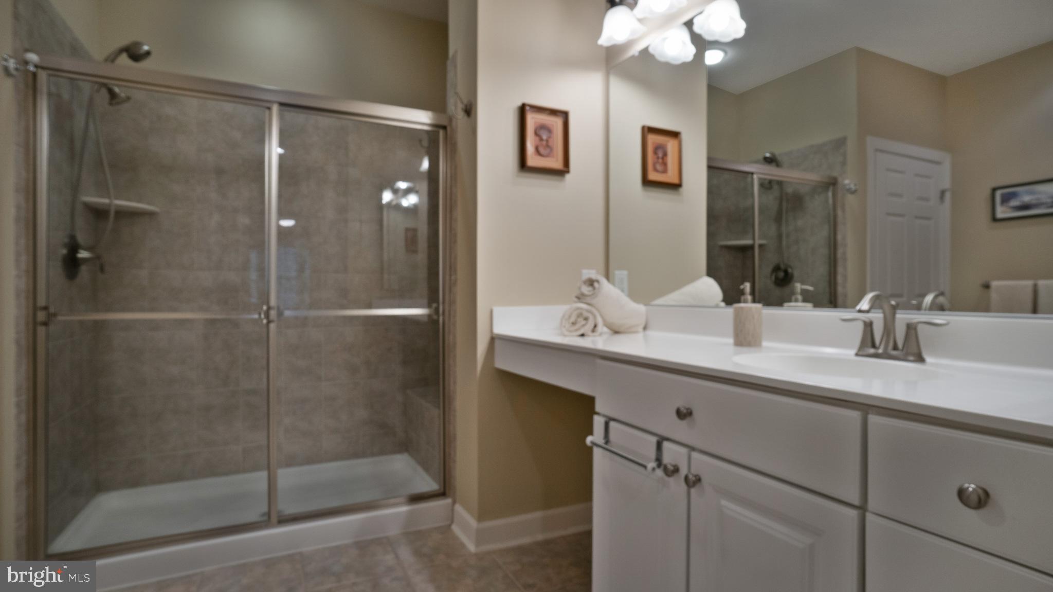 30933 Starling Road, Unit 105A Ocean View, DE 19970 - Photo 18 of 52 with en-suite bath with dual vanities