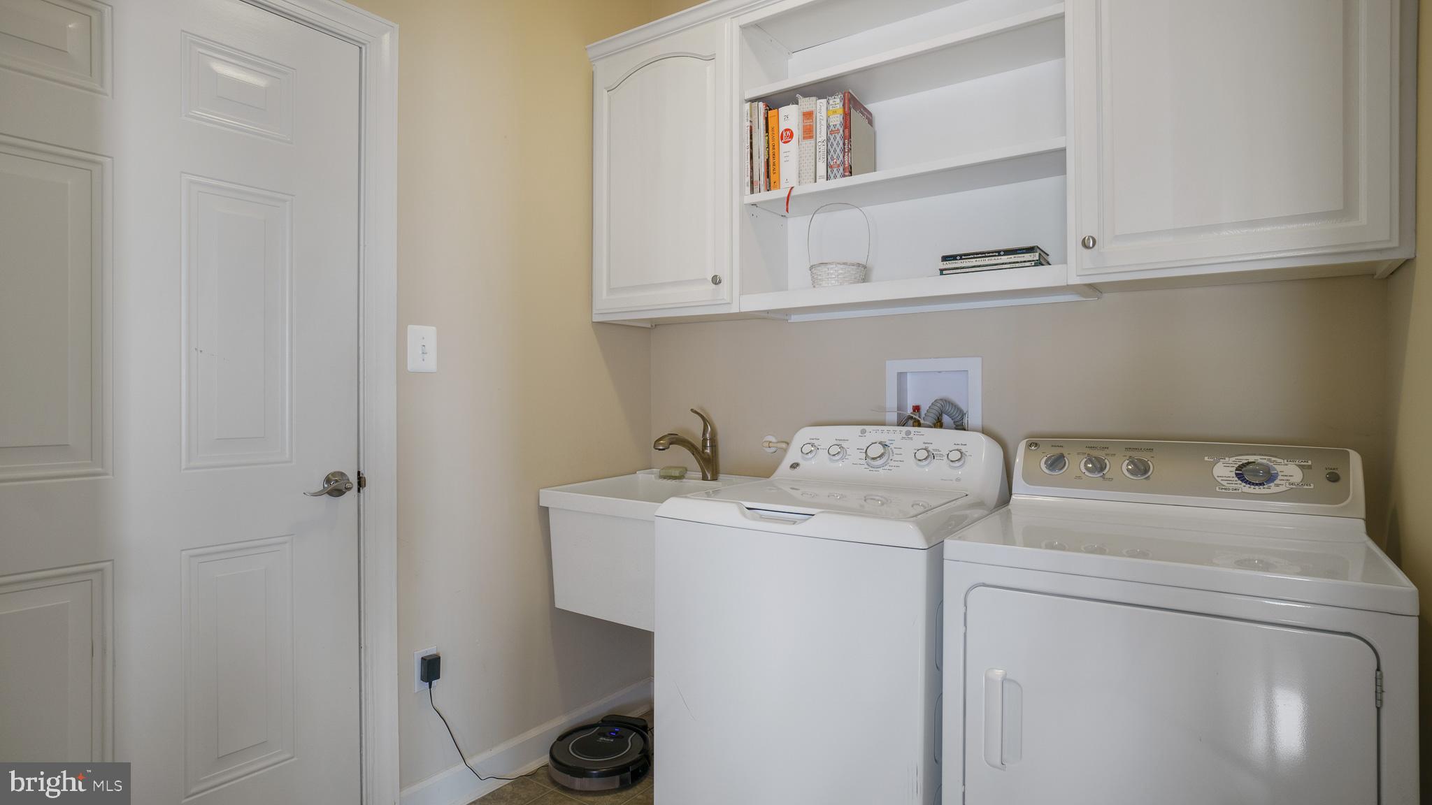 30933 Starling Road, Unit 105A Ocean View, DE 19970 - Photo 27 of 52 Laundry room on main level with tub sink.