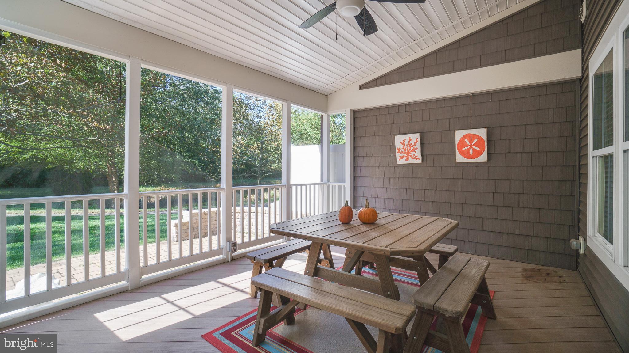 30933 Starling Road, Unit 105A Ocean View, DE 19970 - Photo 28 of 52 Screened-in deck off sunroom perfect for Fall