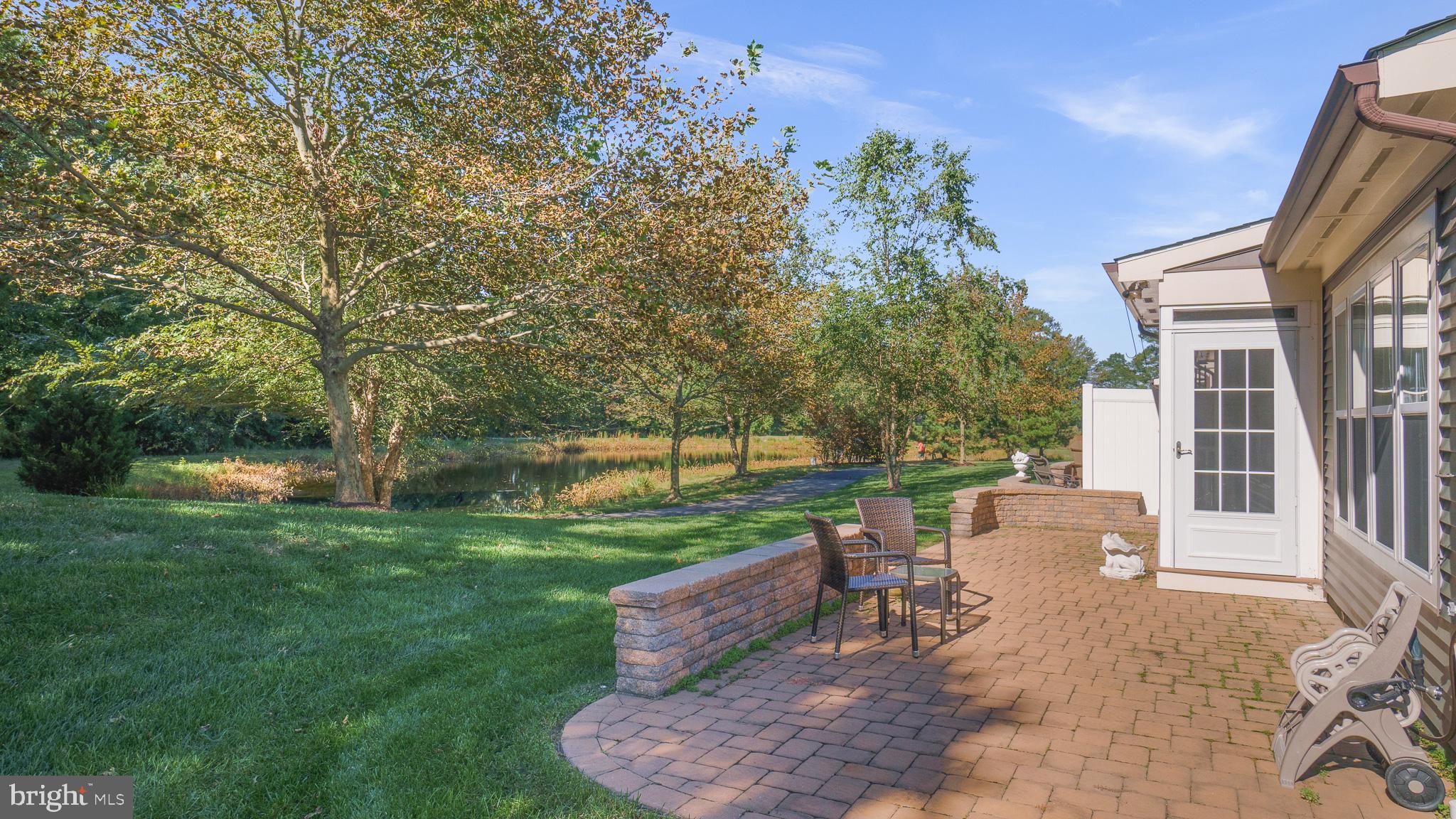 30933 Starling Road, Unit 105A Ocean View, DE 19970 - Photo 29 of 52 Landscaped patio provides more entertaining space