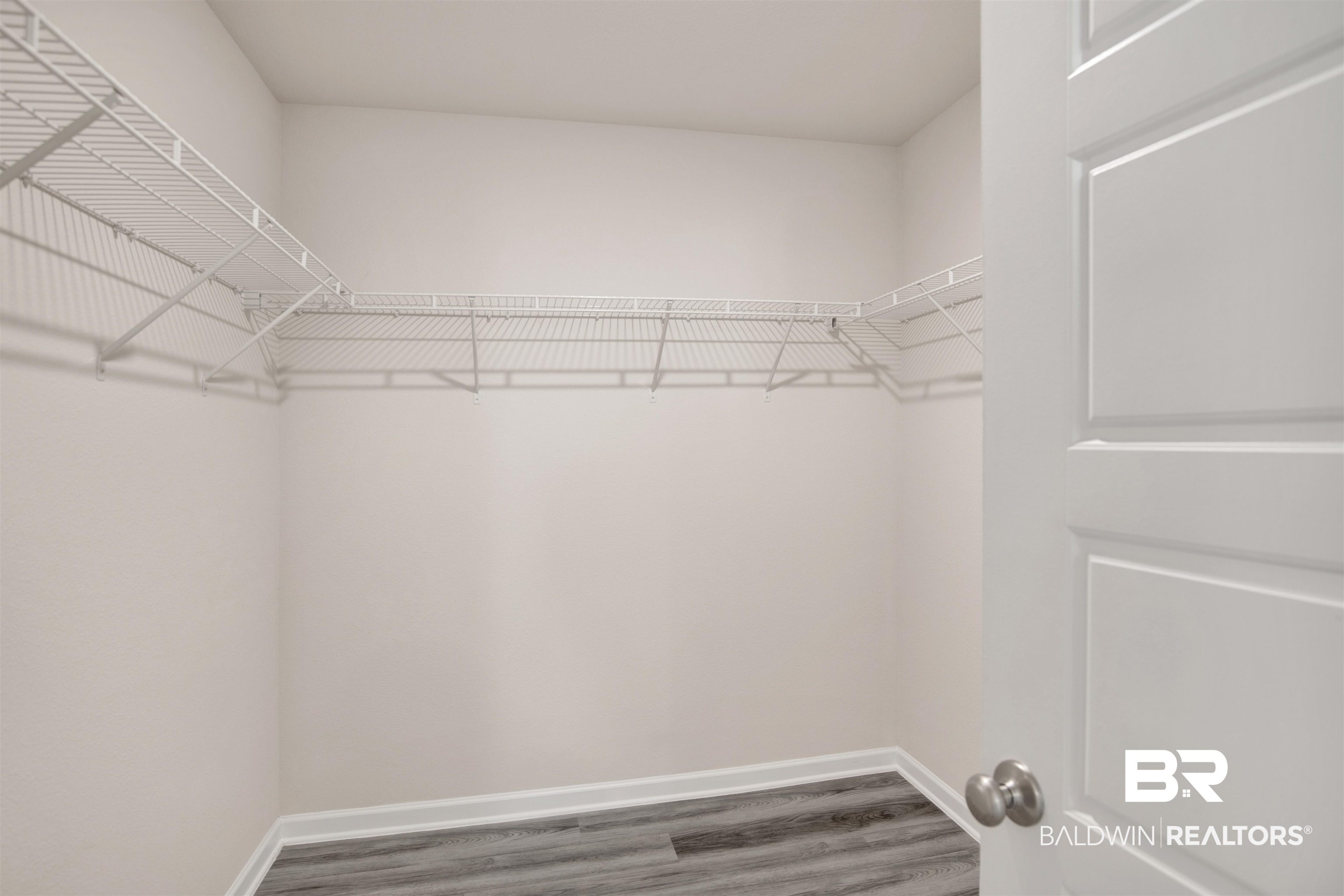 32038 Lyon Road Daphne, AL 36527 - Photo 19 of 30 Spacious closet with wood finished floors