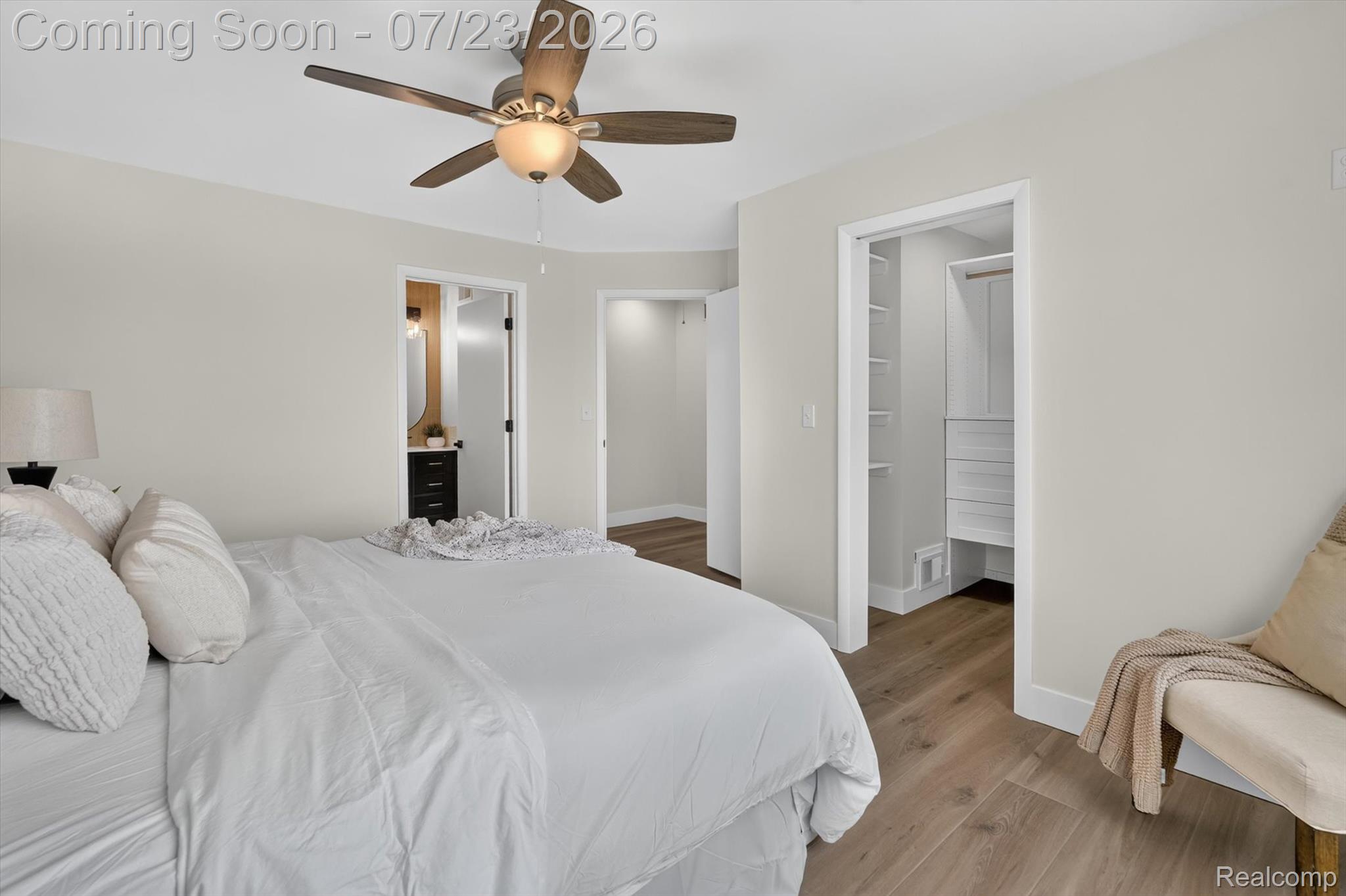 3429 Rolston Road Fenton, MI 48430 - Photo 17 of 62 Bedroom with wood-finish flooring, a ceiling fan, and light-toned walls