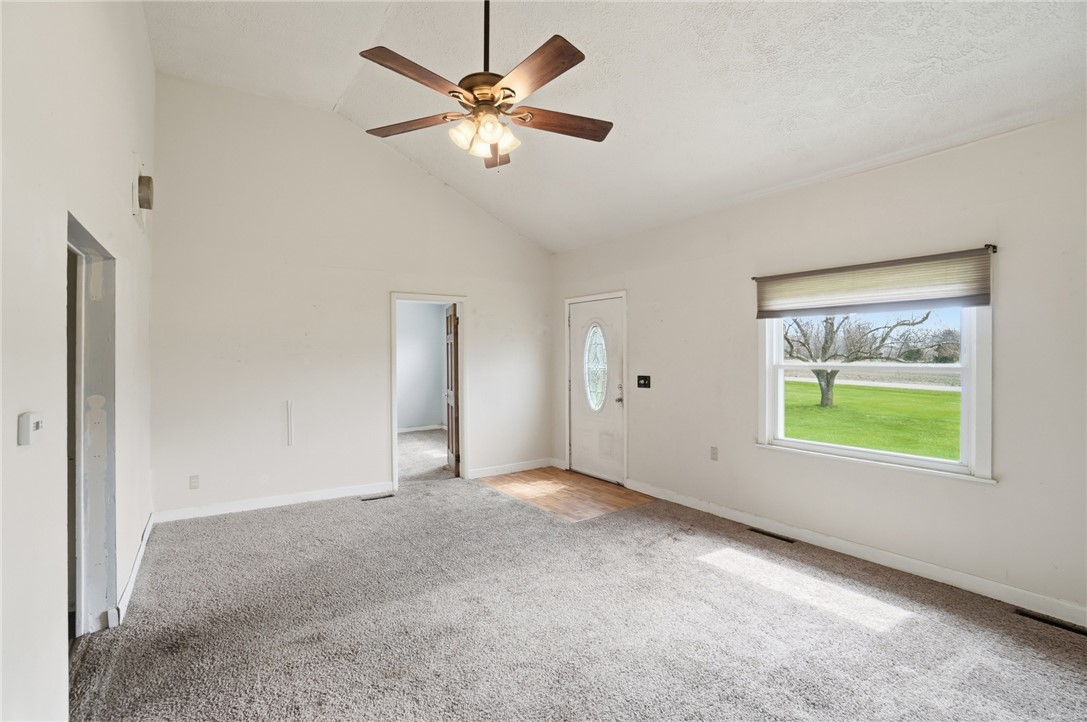 1166 West Sparrow Road Springfield, OH 45502 - Photo 11 of 40 This bright living area features vaulted ceilings, soft carpeting, and a welcoming front entry.