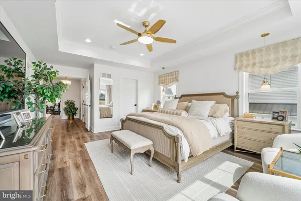 a living room with furniture a rug and a chandelier