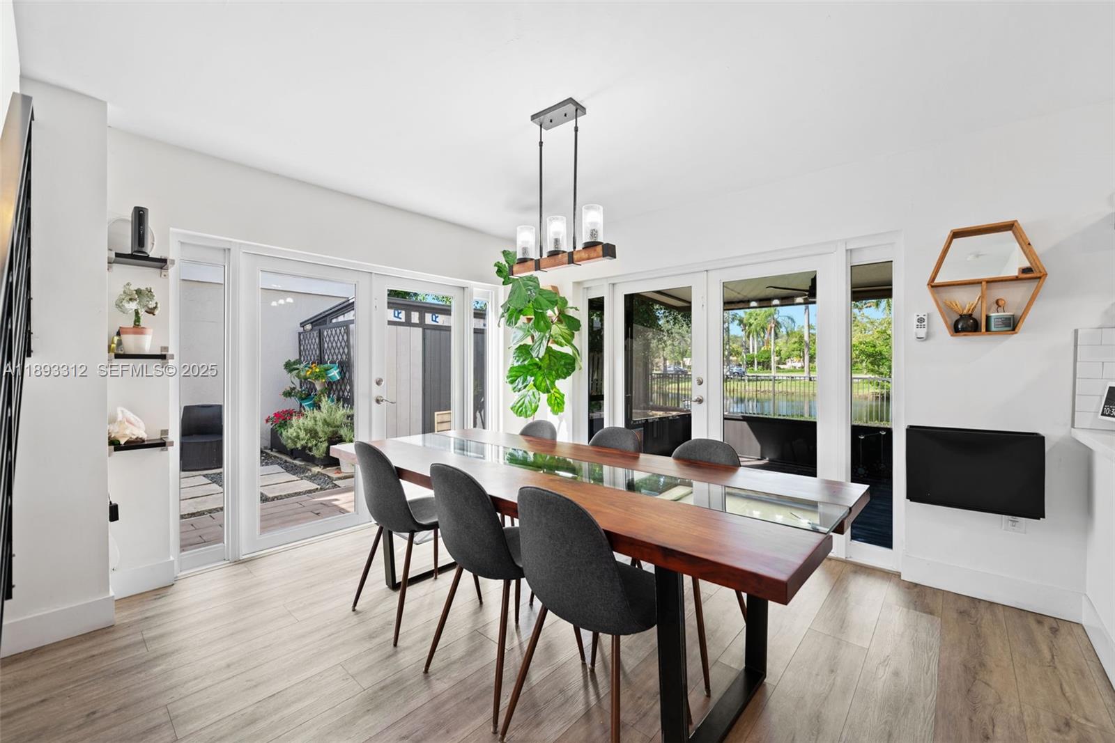139 Southwest 159th Way Sunrise, FL 33326 - Photo 14 of 40 a view of a dining room with furniture window and wooden floor