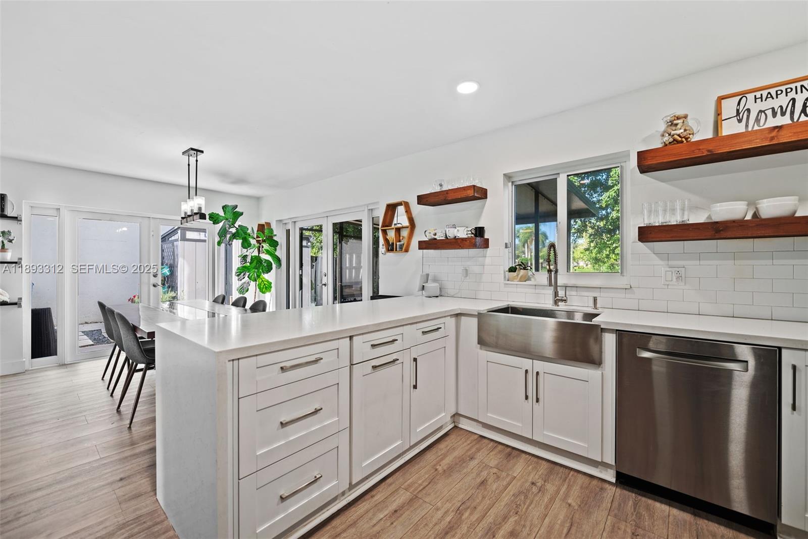 139 Southwest 159th Way Sunrise, FL 33326 - Photo 15 of 40 a kitchen with white cabinets and sink