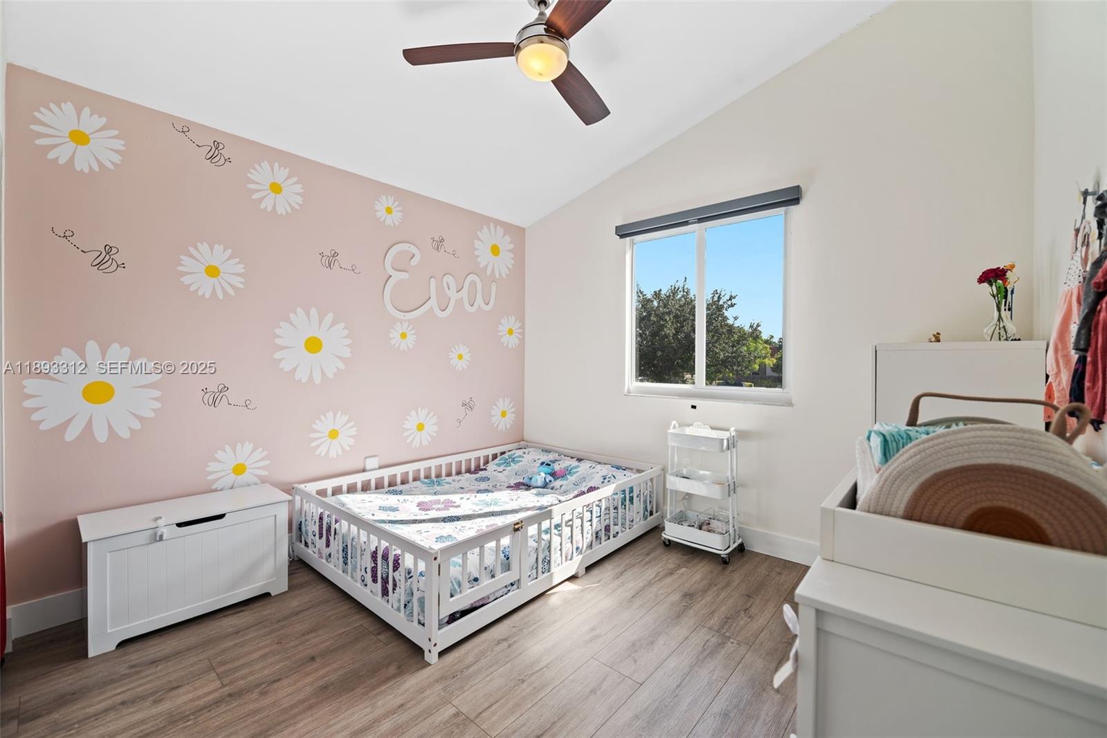 139 Southwest 159th Way Sunrise, FL 33326 - Photo 26 of 40 a bedroom with a bed and a window