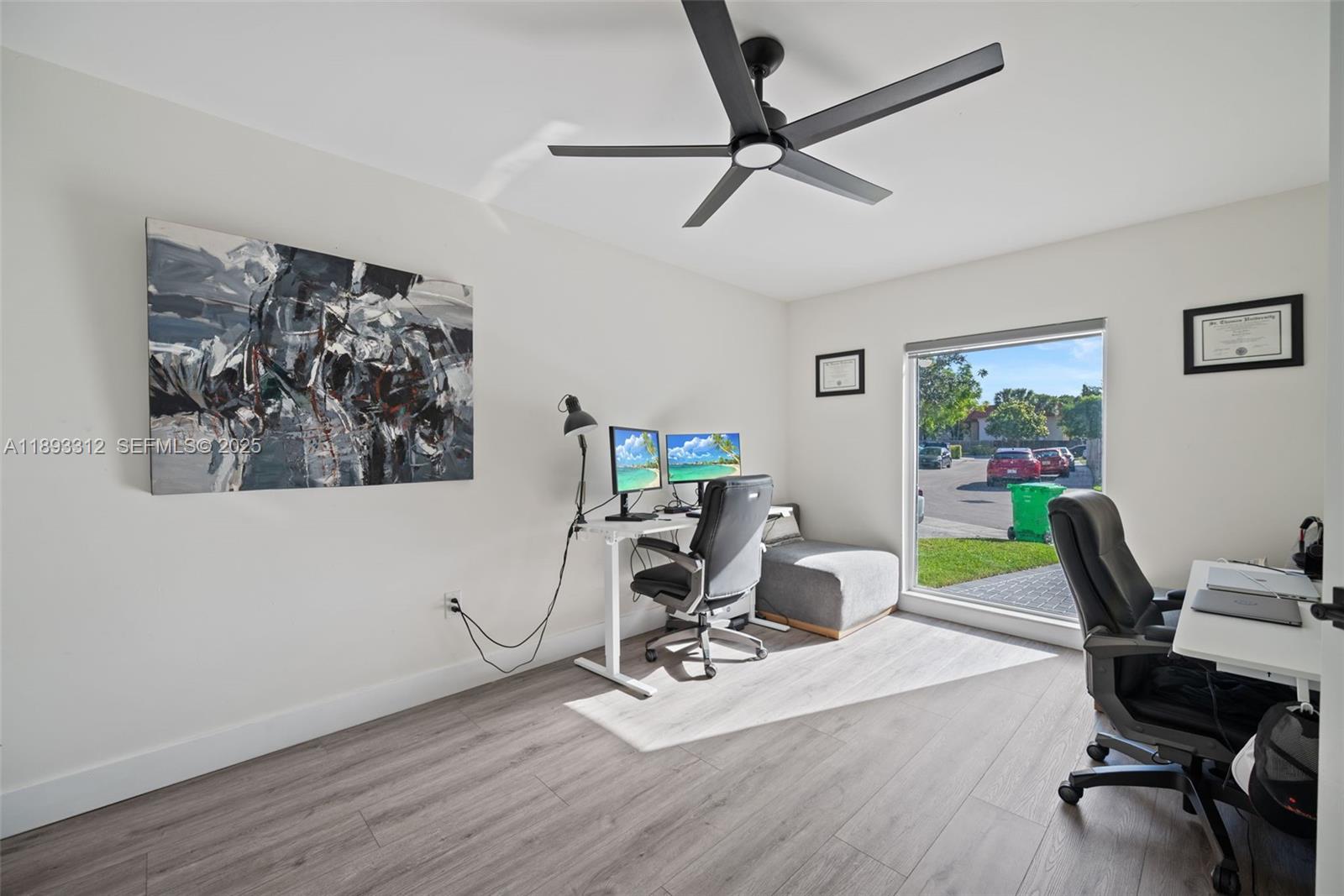 139 Southwest 159th Way Sunrise, FL 33326 - Photo 27 of 40 a view of a workspace with furniture and a window