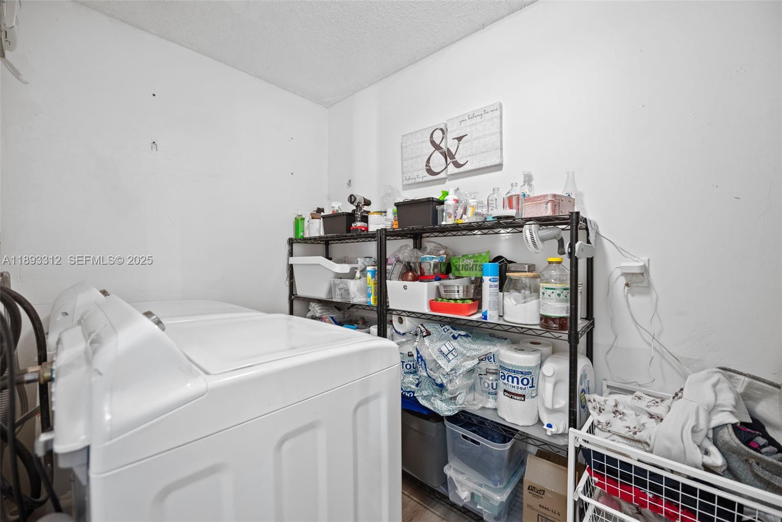 139 Southwest 159th Way Sunrise, FL 33326 - Photo 29 of 40 a utility room with dryer and washer