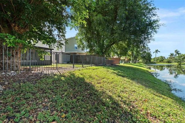 a view of a backyard with a garden and plants