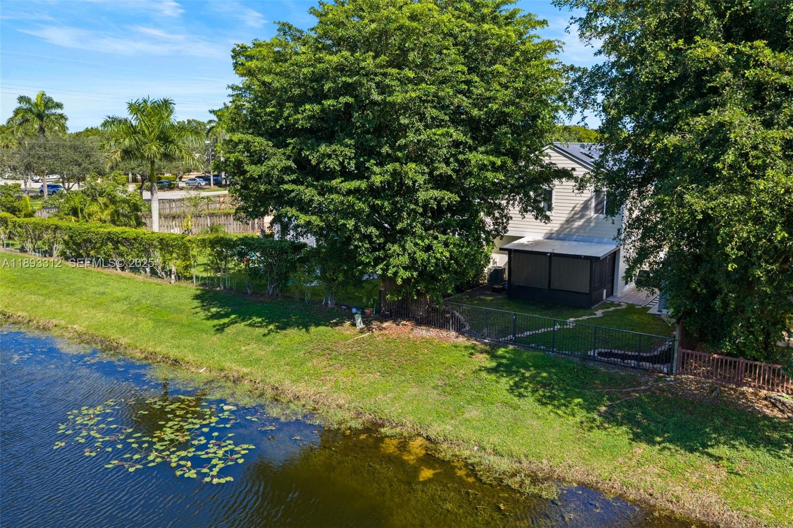 139 Southwest 159th Way Sunrise, FL 33326 - Photo 34 of 40 a view of a garden with a fountain