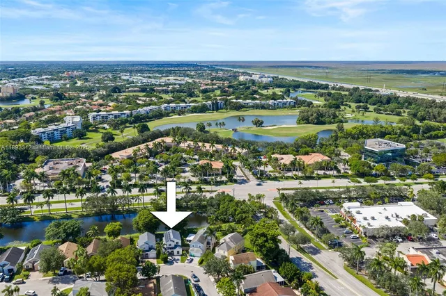an aerial view of residential building and lake