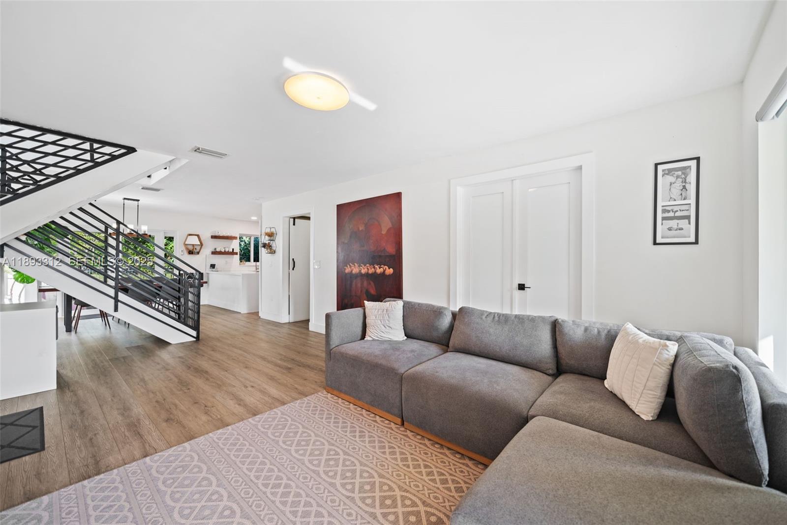 139 Southwest 159th Way Sunrise, FL 33326 - Photo 10 of 40 a living room with furniture and a wooden floor