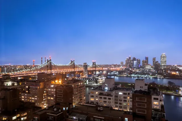 a kitchen with kitchen island granite countertop a stove and a wooden floor