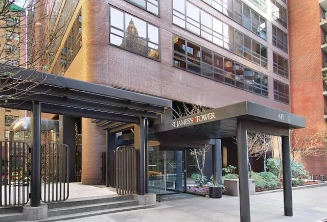 a lobby with furniture and floor to ceiling window
