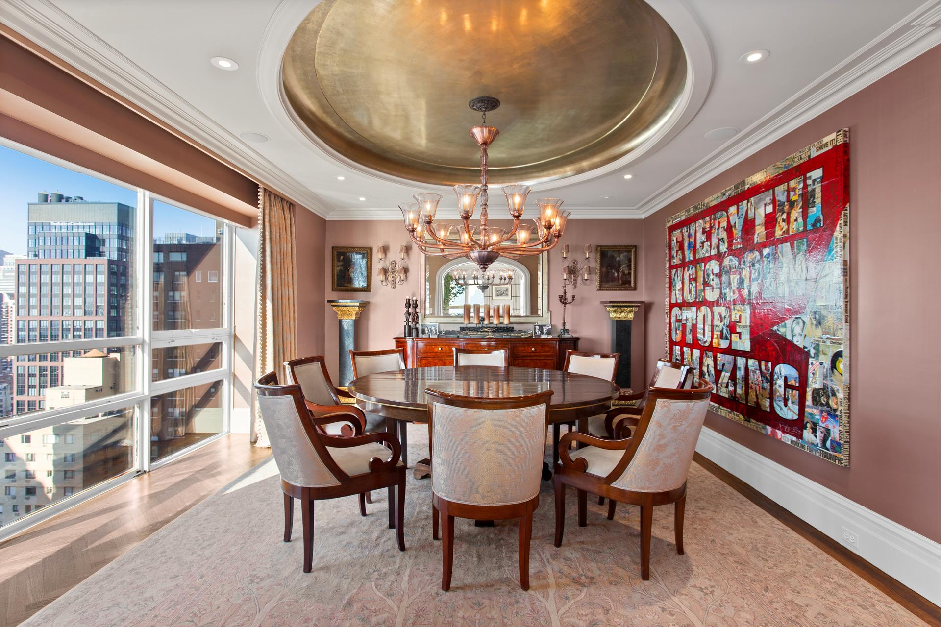 415 East 54th Street, Unit 25GG Manhattan, NY 10022 - Photo 3 of 30 a view of a dining room with furniture and chandelier