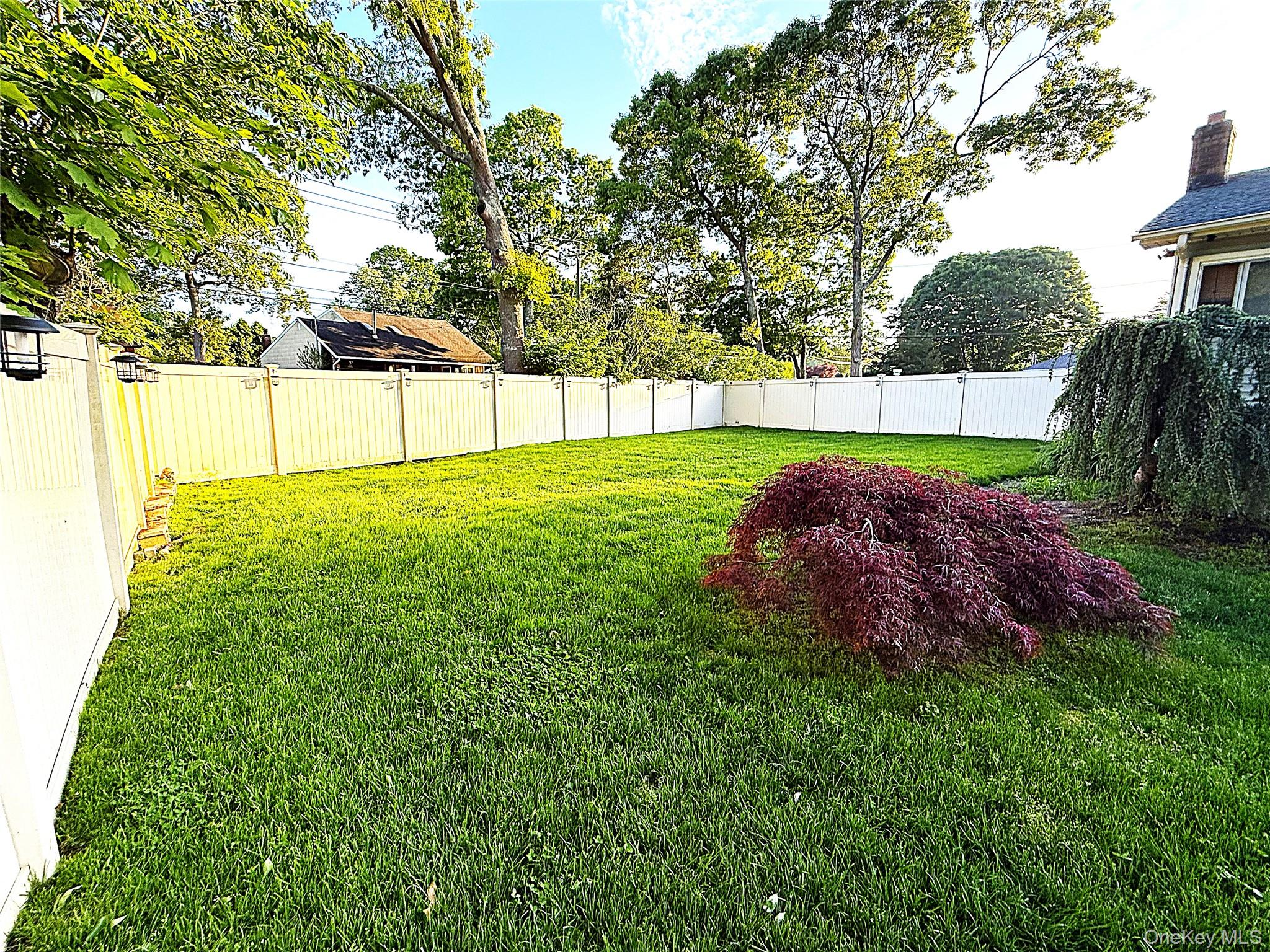 1 Heston Road Shirley, NY 11967 - Photo 30 of 32 Expansive green lawn enclosed by white vinyl fencing