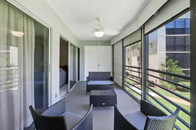 a view of a hallway with furniture