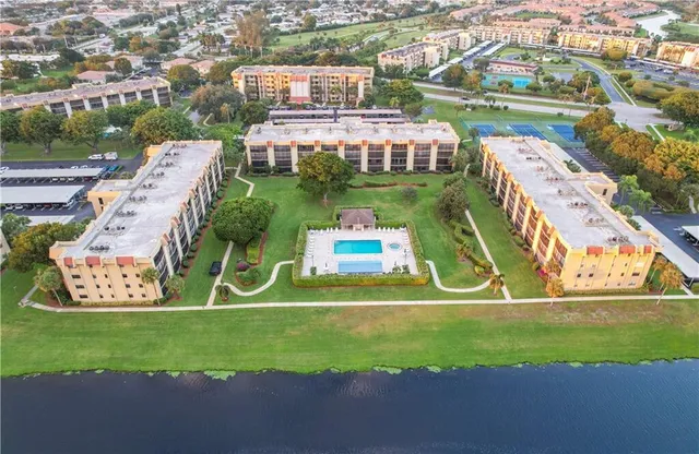 an aerial view of a house with a garden and yard