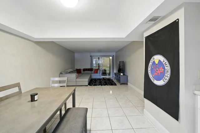 a view of living room with furniture and a flat screen tv