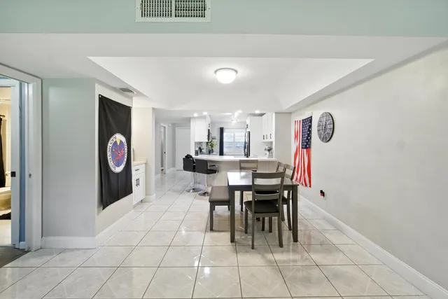 a view of kitchen with furniture and window