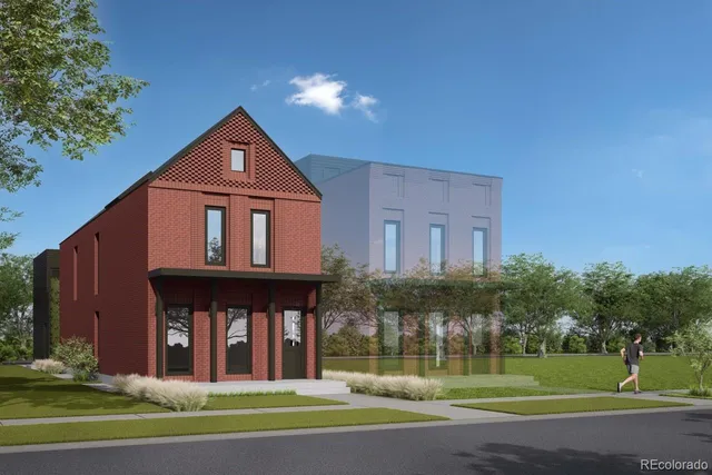a view of a brick house with a big yard and large trees