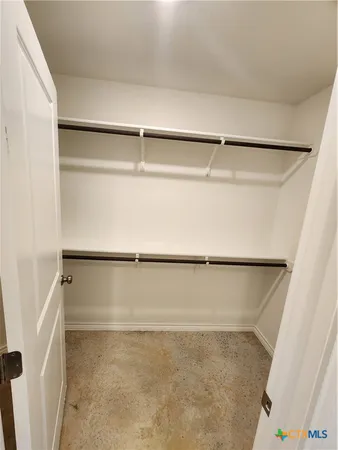 a view of an empty walk in closet