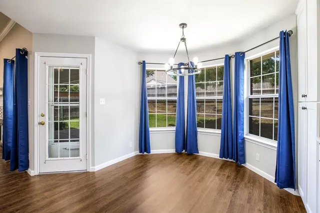 a view of empty room with windows