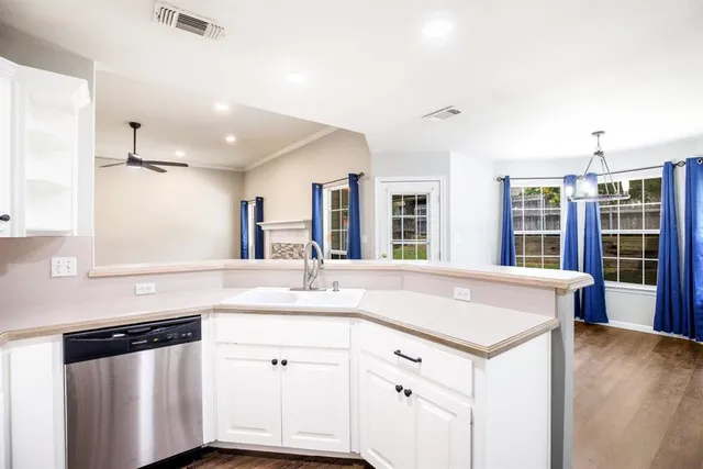 a bathroom with a sink double vanity and a mirror