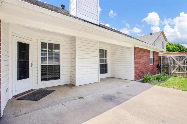 a view of a house with a yard and garage