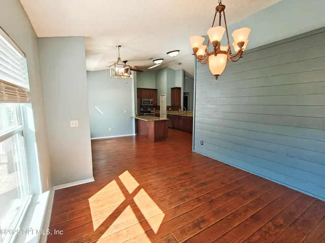 an empty room with a empty space and a window