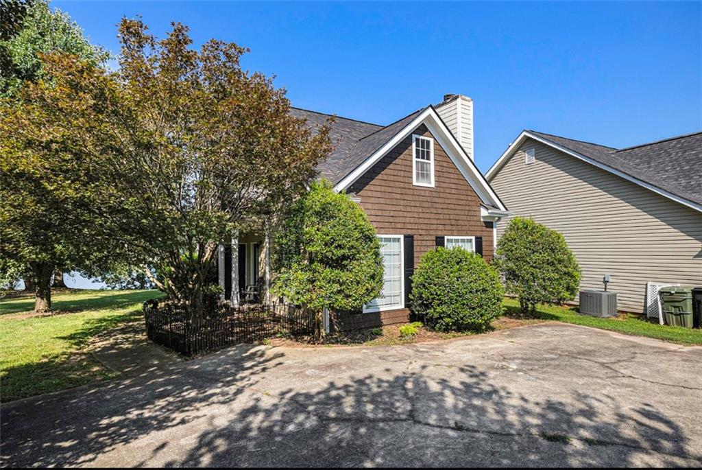 102 Turtle Pointe Drive Carrollton, GA 30116 - Photo 1 of 1 a front view of a house with a yard