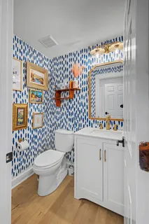 a bathroom with a sink a toilet and a shower