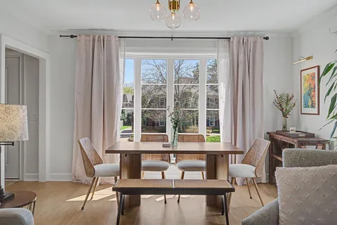 a view of a dining room with furniture window and outside view