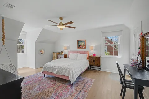 a bedroom with a bed and a table in it