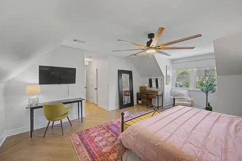a bathroom with a granite countertop toilet sink and shower
