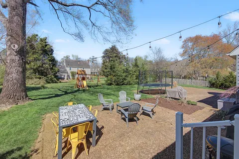a view of a park with large trees